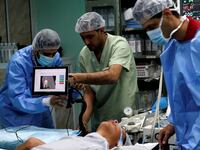 Palestinian surgeon Hafez Abu Khousa in the operating room at Al Awda Hospital in the northern Gaza Strip