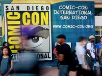 Attendees walk outside the Convention Center during the 2014 Comic-Con International Convention. A slew of studios and productions have canceled their panels at the upcoming 2023 San Diego Comic-Con now that the Screen Actors Guild is on strike.
