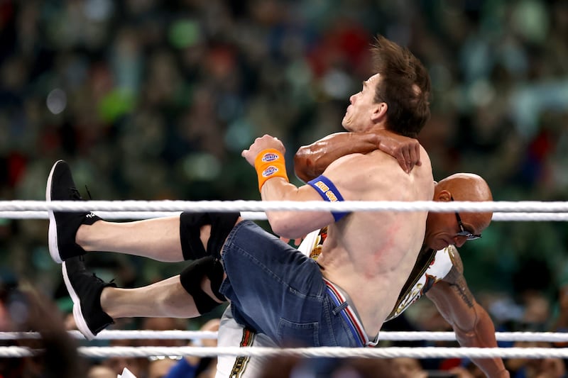 PHILADELPHIA, PENNSYLVANIA - APRIL 07: Dwayne "The Rock" Johnson and John Cena fight during Night Two at Lincoln Financial Field on April 07, 2024 in Philadelphia, Pennsylvania. (Photo by Tim Nwachukwu/Getty Images)