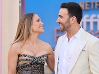 Jennifer Lopez and Brett Goldstein attend the world premiere of Netflix's Office Romance on May 26, 2026 in Los Angeles.