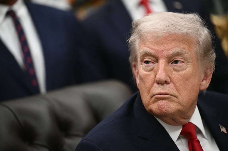 US President Donald Trump looks on after signing the "Great American Recovery Initiative" aimed at combating addiction and substance abuse in the Oval Office of the White House in Washington, DC, on January 29, 2026. (Photo by Brendan SMIALOWSKI / AFP via Getty Images)