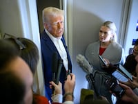 US President Donald Trump speaks with the press, alongside White House Press Secretary Karoline Leavitt, on board Air Force One after departing Las Vegas, Nevada, en route to Miami, Florida on January 25, 2025.