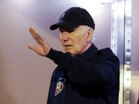Joe Biden waving form the steps of Air Force One
