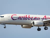 Caribbean Airlines Boeing 737-800 commercial aircraft as seen on final approach landing at New York JFK John F Kennedy International airport in NY, USA. The B737 airplane has the registration 9Y-TAB and paint on the tail of a hummingbird. Caribbean Airlines Limited BW BWA is the state-owned airline and flag carrier of Trinidad and Tobago, Headquartered in Iere House in Piarco, the airline operates flights to the Caribbean, North America and South America. February 13, 2020 (Photo by Nicolas Economou/NurPhoto via Getty Images)
