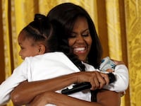 articles/2015/04/28/how-michelle-obama-became-hugger-in-chief/150427-shire-obama-tease_wzszmd