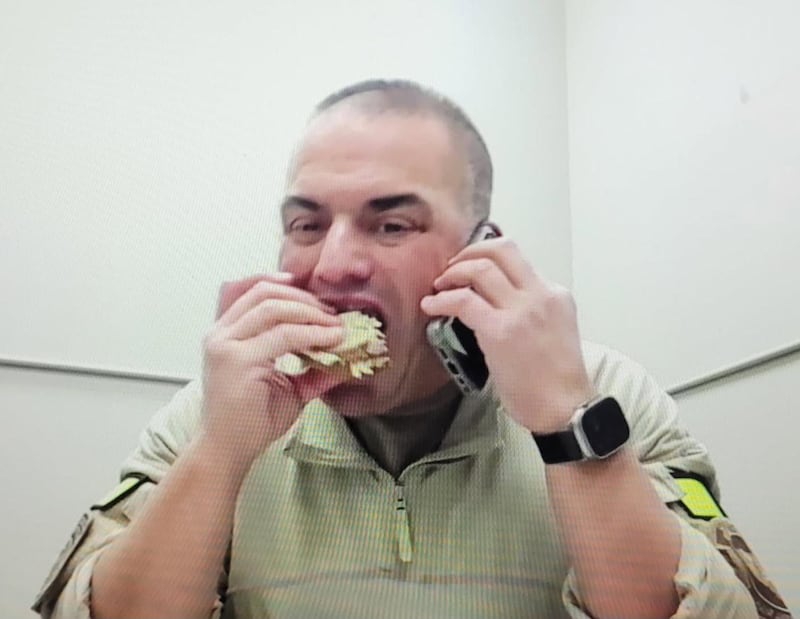 Dr. Alexander Eastman, eating on the job.