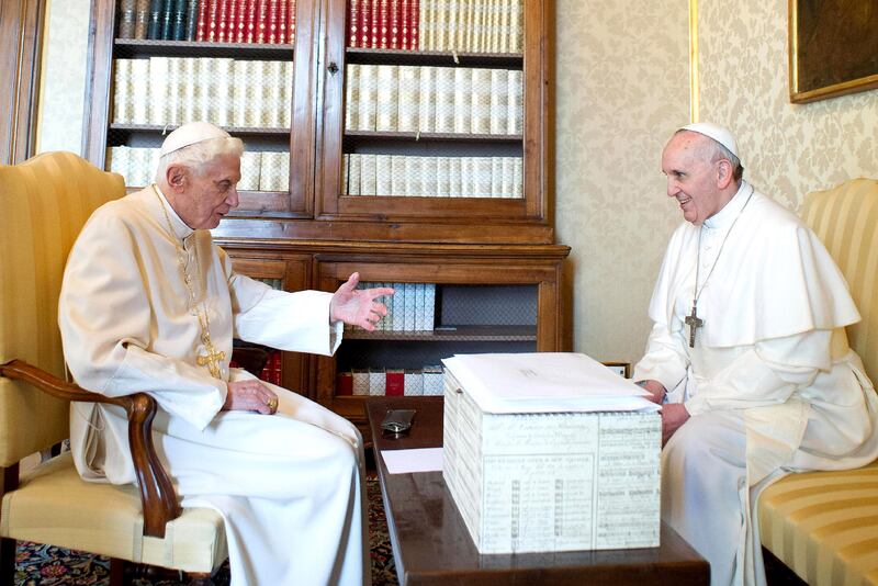 Pope Benedict XVI , left, seen with Pope Francis, was selected in 2005 after four ballots.