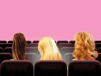 A photo illustration that shows barbie dolls looking at their phones while in the movie theater