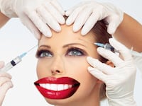 image of woman with bigger red lipstick lips and eyes and hands holding needles medscape medicine health plastic surgery surgeon happiness satisfaction burnout depression suicide celebrity boob job butt cosmetic reconstruction reconstructive money