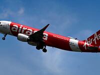An AirAsia passenger plane takes off.