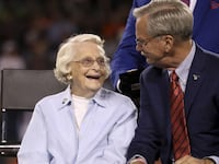 Virginia McCaskey looks up at Bears Chairman George McCaskey before Brian Urlacher was awarded with a ring of excellence during halftime between the Bears and the Seattle Seahawks at Soldier Field in Chicago on Sept. 17, 2018. (Armando L. Sanchez/Chicago Tribune/Tribune News Service via Getty Images)