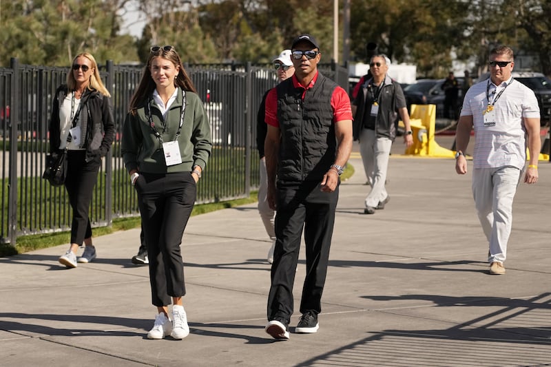 Vanessa Trump, far left, Kai Trump (L) and Tiger Woods seen at the Torrey Pines Golf Course on February 16.