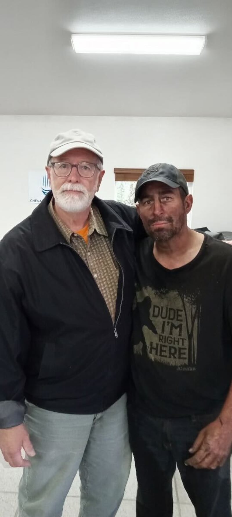 A photo of Jonas Bare and his father, following Bare’s rescue on Friday.
