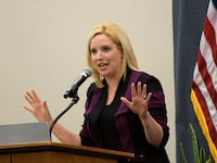 Rep. Ashley Hinson speaks during an Iowa GOP reception in May.