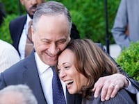 Kamala Harris and Douglass Emhoff embrace each other while smiling