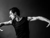 A black and white portrait of Justin Peck.
