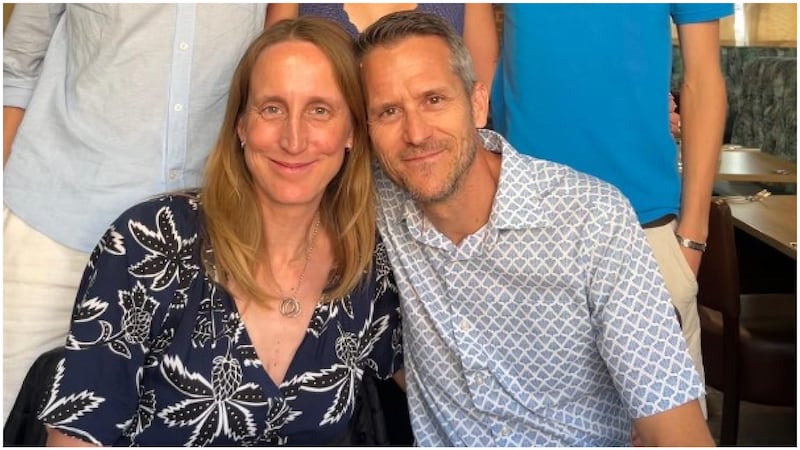Kim Oakhill poses in a family photo with her husband on the Crowdfunding website.