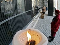 articles/2012/04/17/zionism-denial/holocaust-memorial-candle-openz_xixl0a