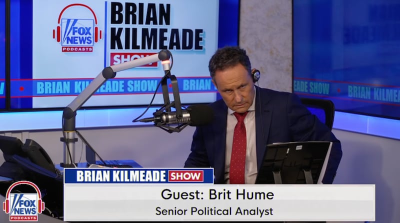 A photo of Fox News host Brian Kilmeade in a telephone conversation with senior political analyst Brit Hume