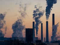 A power plant emitting smoke from its smokestacks.