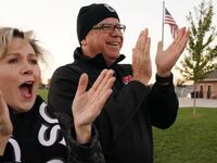 Gwen and Tim Walz at their daughter's soccer game in 2018.