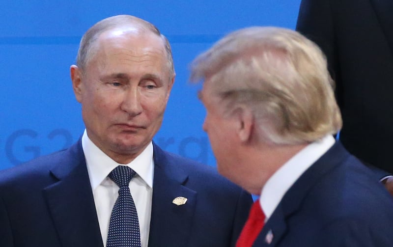 Russian President Vladimir Putin (L) looks at President Donald Trump during the welcoming ceremony prior to the G20 Summit's Plenary Meeting on November 30, 2018.