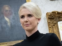 Executive Assistant to the President Natalie Harp, 34, stands in the Oval Office on March 31.