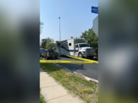 Police tape near the home where the triple homicide took place.