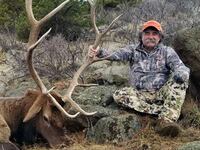 Ernie Dosio with a dead animal he killed and hunted