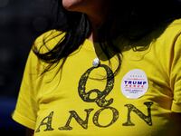 2020-11-01T194826Z_1133111502_RC2JUJ9YNP6P_RTRMADP_3_USA-ELECTION-QANON-CYBER_yzpg4d