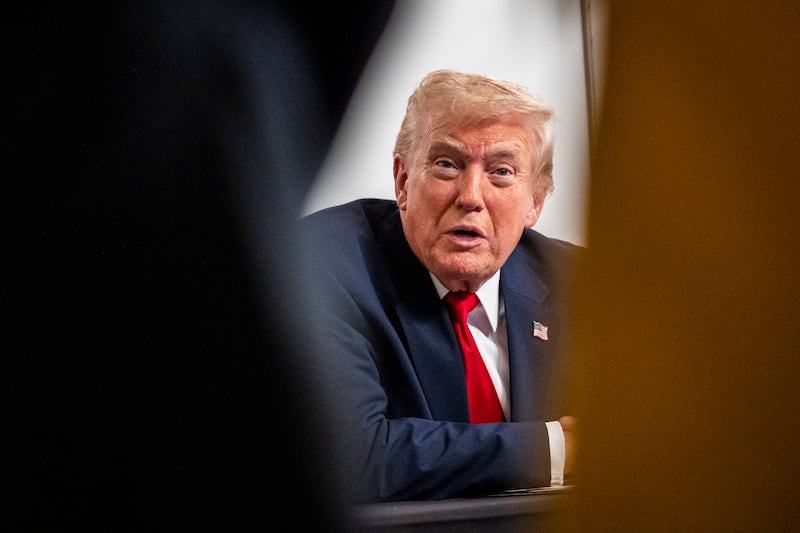 President Donald Trump participates in a call with U.S. service members from his Mar-a-Lago club in Florida on Thanksgiving Day on November 27, 2025 in Palm Beach, Florida.
