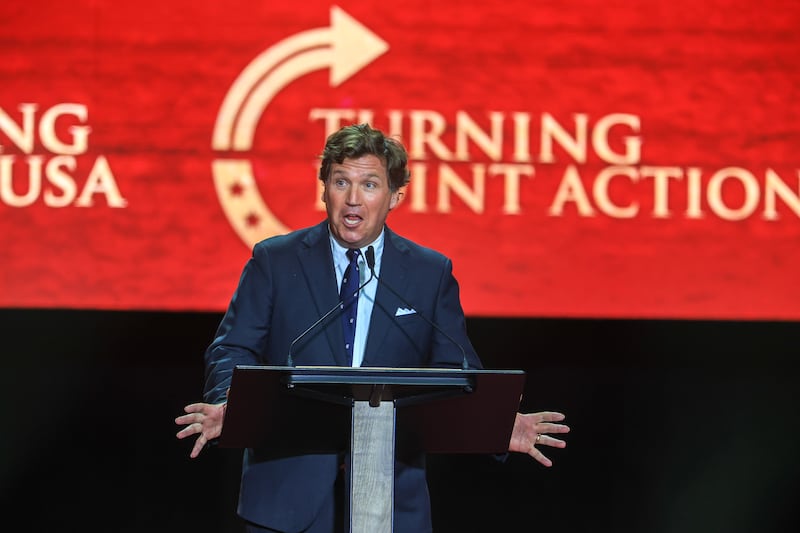 GLENDALE, ARIZONA - SEPTEMBER 21: Political commentator Tucker Carlson speaks during the memorial service for political activist Charlie Kirk at State Farm Stadium on September 21, 2025 in Glendale, Arizona. Kirk, the CEO and co-founder of Turning Point USA, was shot and killed on September 10th while speaking at an event during his "American Comeback Tour" at Utah Valley University. (Photo by Joe Raedle/Getty Images)