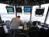A library photo of air traffic controllers in the control tower at LaGuardia Airport in Queens, New York.