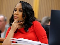 Fulton County District Attorney Fani Willis listens during the final arguments in her disqualification hearing at the Fulton County Courthouse in Atlanta, Georgia.