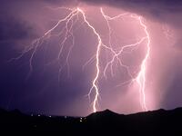 Forked cloud-to-ground lightning with lateral discharge channels, Tucson Mountains, Tucson, Arizona, USA.