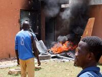 Pro-junta demonstrators gathered outside the French Embassy, try to set it on fire before being dispersed by Nigerien security forces in Niamey, the capital city of Niger, July 30, 2023.