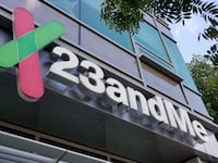 Sign with logo on facade of personal genomics company 23andMe.