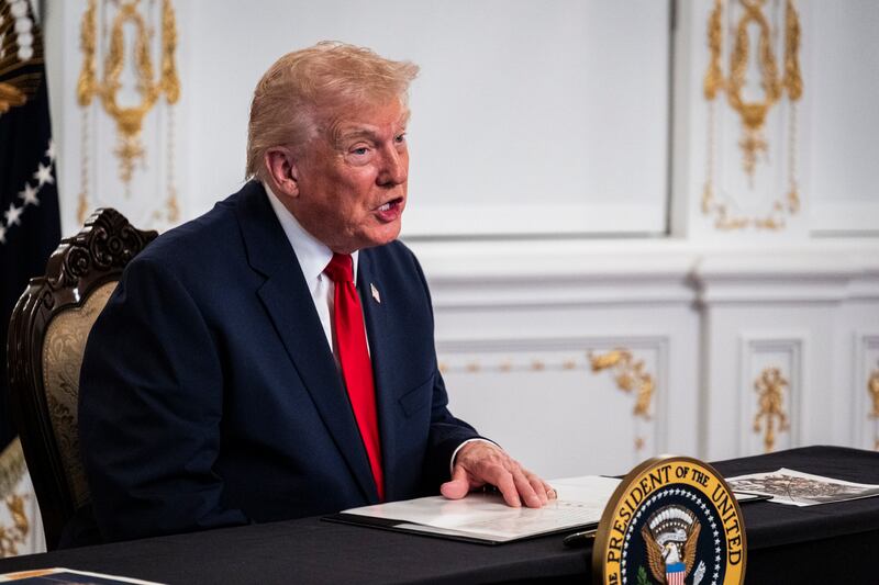 President Donald Trump participates in a call with U.S. service members from his Mar-a-Lago club in Florida on Thanksgiving Day on November 27, 2025 in Palm Beach, Florida.
