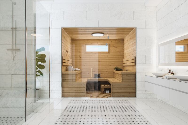 Wooden sauna in a modern, luxurious bathroom.