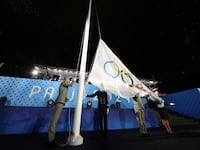 The Olympic Flag is raised at Place du Trocadero during the opening ceremony of the Olympic Games Paris 2024.