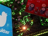 The Twitter logo on a control board of a computer