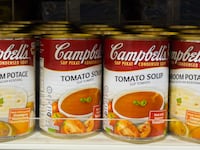 KK Mart Kuala Lumpur, Malaysia, shelf display of Campbell's soup cans in a grocery store.