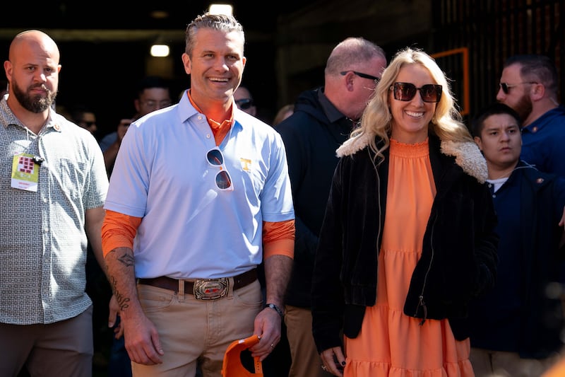 Pete and Jennifer Hegseth watch warmups before the Tennessee Volunteers and the Alabama Crimson Tide play at Neyland Stadium in Knoxville, Tennessee, on October 17, 2026.