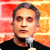 A photo illustration of Bassem Youssef performing.