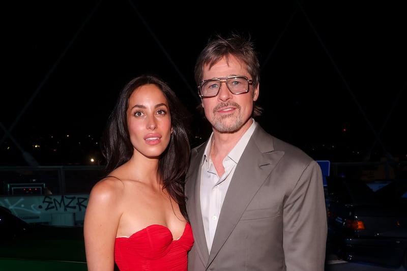 Ines de Ramon and Brad Pitt pose for a picture at the Mercedes-AMG World Premiere in 2026.