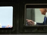 US President Donald Trump speaks with First Lady Melania Trump onboard Marine One