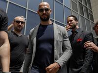 Andrew Tate and his brother Tristan Tate, both escorted by bodyguards, leave the Bucharest Tribunal in Bucharest, Romania, June 21, 2023.