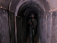 An Israeli soldier walks through a tunnel underneath Al Shifa Hospital in Gaza City, amid the ongoing ground operation of the Israeli army against Palestinian Islamist group Hamas