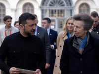 President Volodymyr Zelenskiy holds a letter from King Charles, given to him by Princess Anne, in Kiev, Ukraine.