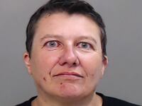 Pascale Cecile Veronique Ferrier, 55, is seen in a mugshot image.